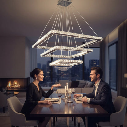 Lysverden two-tier square crystal LED pendant light hanging over a dining table with a couple in a modern apartment