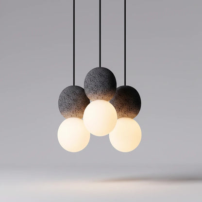 Lysverden Steinpendel cluster pendant light with grey textured stone spheres and glowing opal glass globes