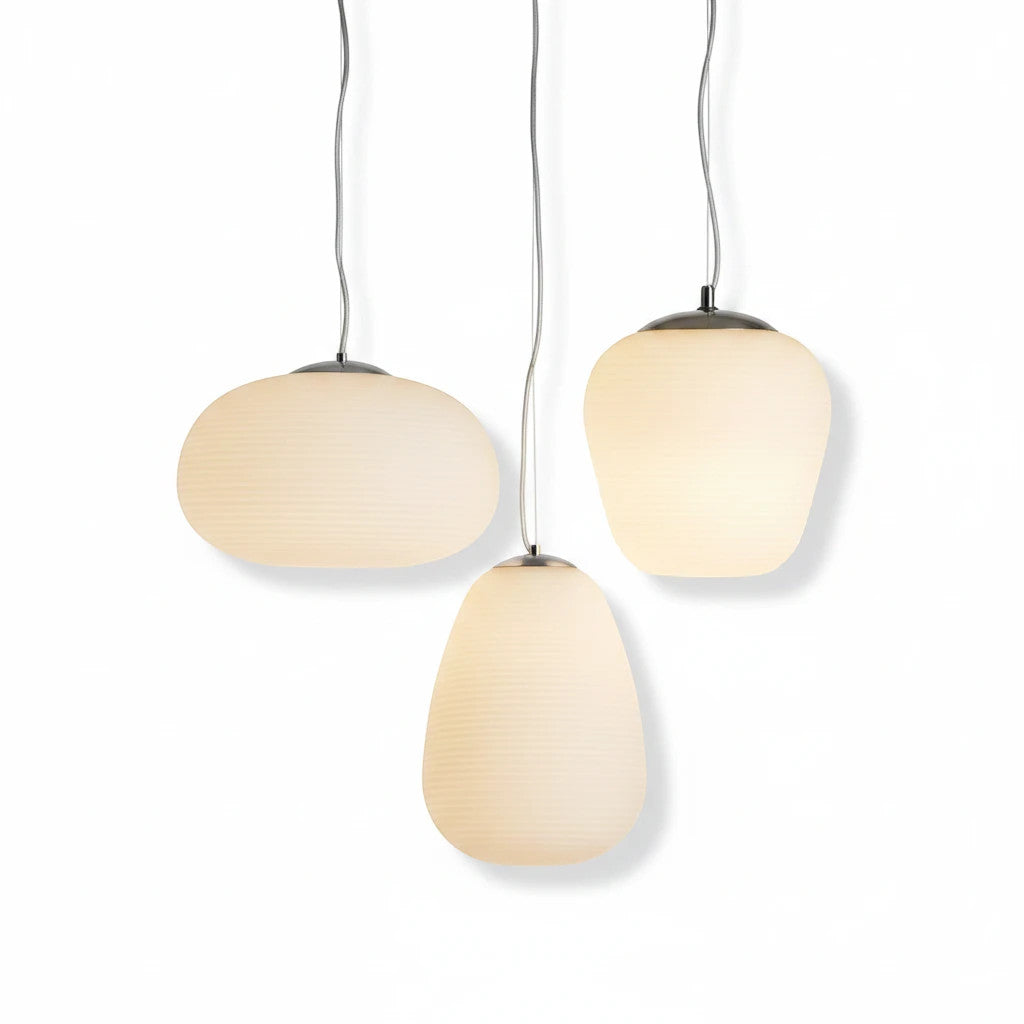 Lysverden Steinpendel set of three organic matte white glass pendant lights with a soft, diffused glow.