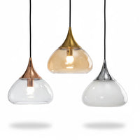 Lysverden teardrop glass pendant lights with gold, rose gold, and silver metal tops hanging in a group.