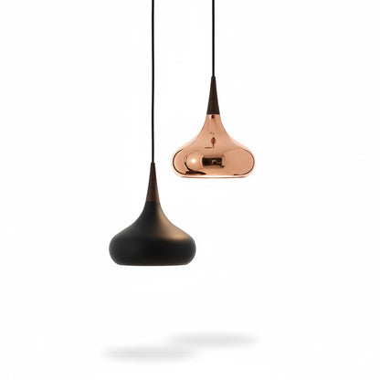Lysverden teardrop pendant lamps in matte black and metallic copper with wooden accents hanging against white background
