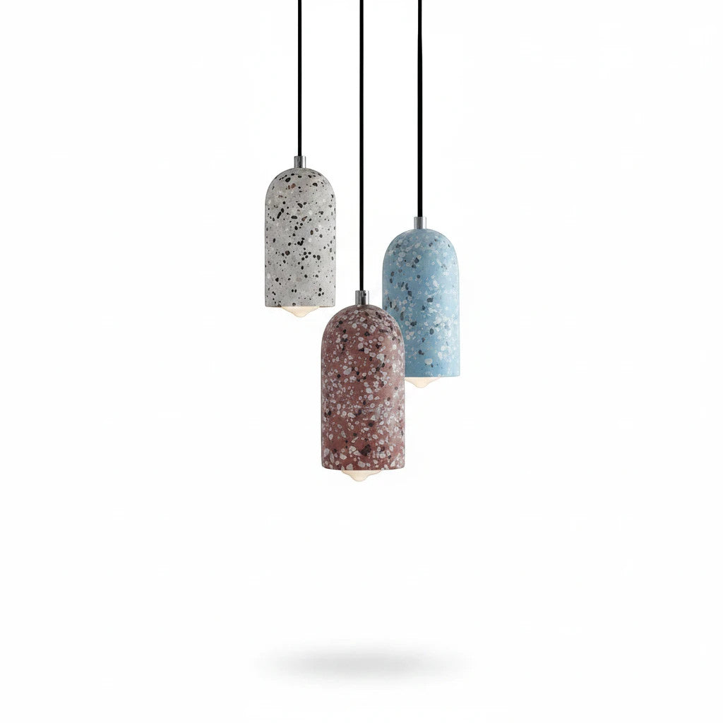 Lysverden TERRAZZO pendant lights in blue, white, and red concrete with unique stone patterns hanging in a cluster.