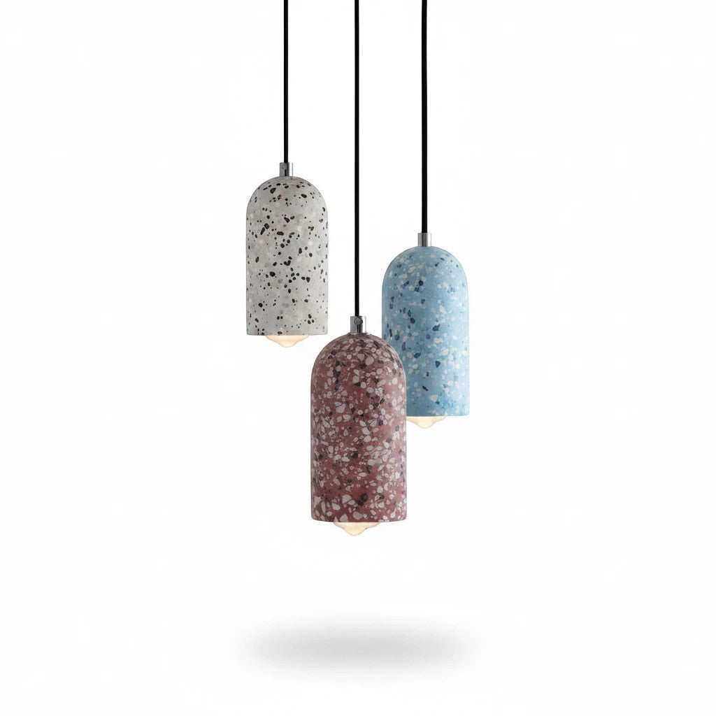 Lysverden Terrazzo pendant lights in blue, white, and red concrete with unique stone patterns hanging in a cluster.