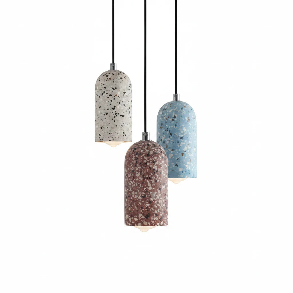Lysverden TERRAZZO pendant lights in blue, white, and red speckled concrete with a minimalist cylindrical design.