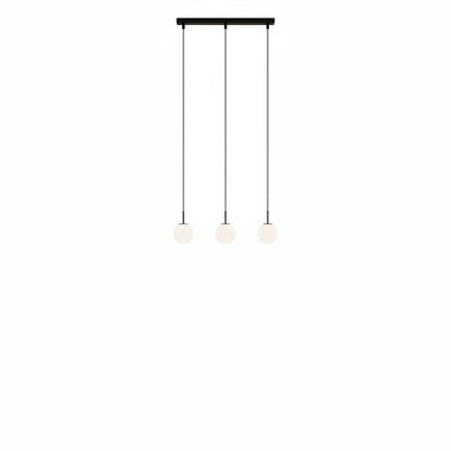 Lysverden modern pendant light with three white glass globes on slim black cylinders hanging from a rectangular base