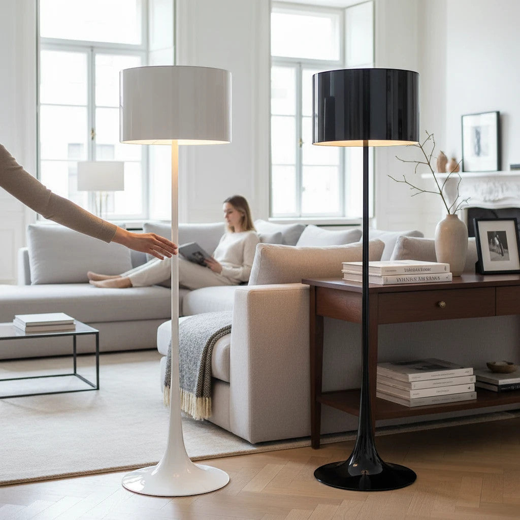 Lysverden floor lamps with tulip bases and cylindrical shades in black and white, placed in a bright modern living room.