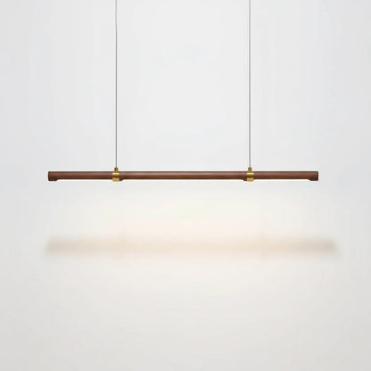 Lysverden linear LED pendant lamp in walnut wood with brass accents, minimalist Japandi style light bar.