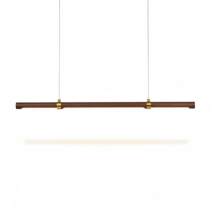 Lysverden linear LED pendant light in walnut wood with brass accents, featuring a minimalist Japandi design.