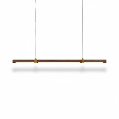 Lysverden linear LED pendant light in walnut wood with brass accents, featuring a minimalist Japandi design.