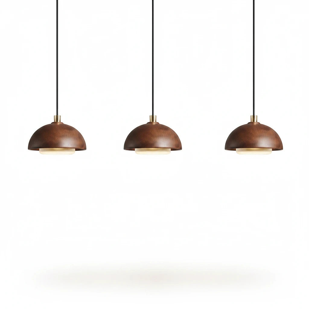 Lysverden set of three round walnut wood pendant lights with integrated warm LED lighting in a minimalist style.