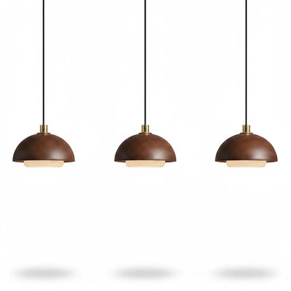 Lysverden set of three round walnut wood pendant lights with integrated warm LED lighting in a minimalist Japandi style