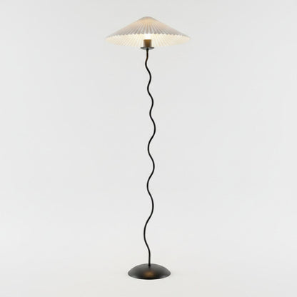 Lysverden sculptural floor lamp with a black wavy stem and a pleated white disc shade on a round base.