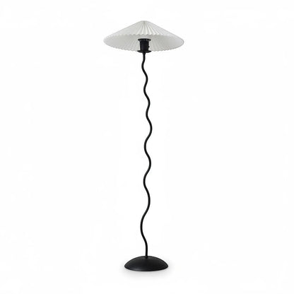 Lysverden sculptural floor lamp with a black wavy metal stem and a white pleated disc shade on a round base.