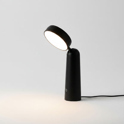 Lysverden white ABS desk lamp with round, magnifying glass-like light element, touch control, and adjustable head.