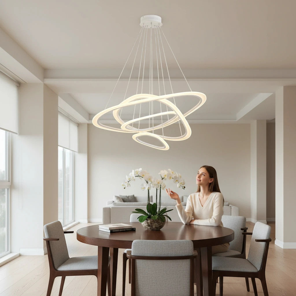 Lysverden modern white LED ring chandelier with concentric rings hanging over a dining table in a bright living room.