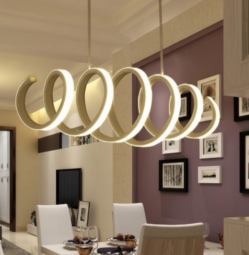 Lysverden modern white LED ring pendant light with a graphic spiral design hanging over a dining table.