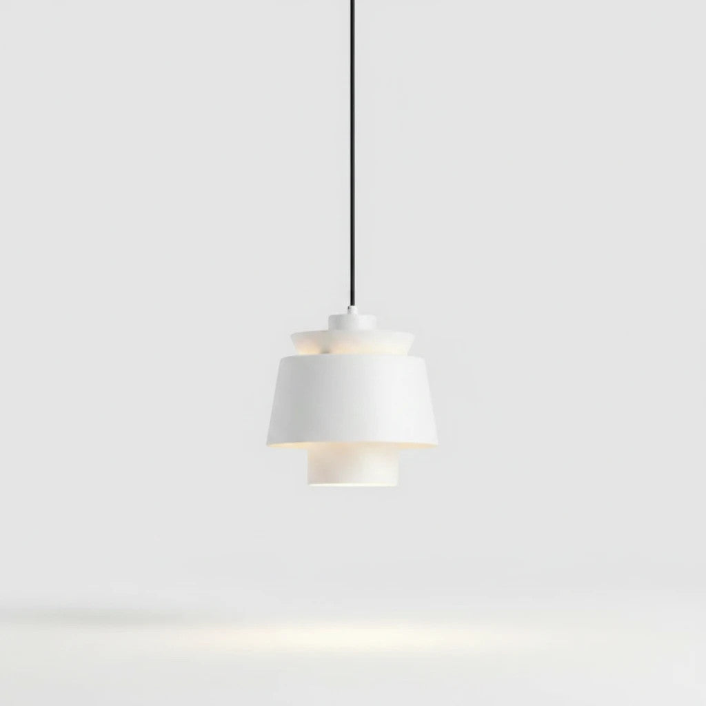 Lysverden white metal drum pendant light with a minimalist Scandinavian design hanging against a plain background