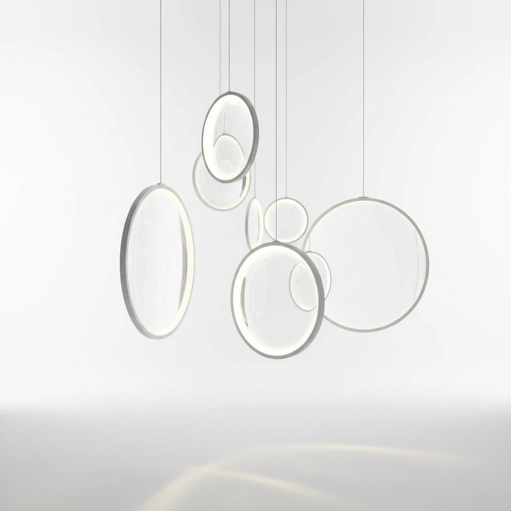 Lysverden ring-shaped LED pendant lights in white acrylic, arranged in a modern sculptural cluster for interior decor.