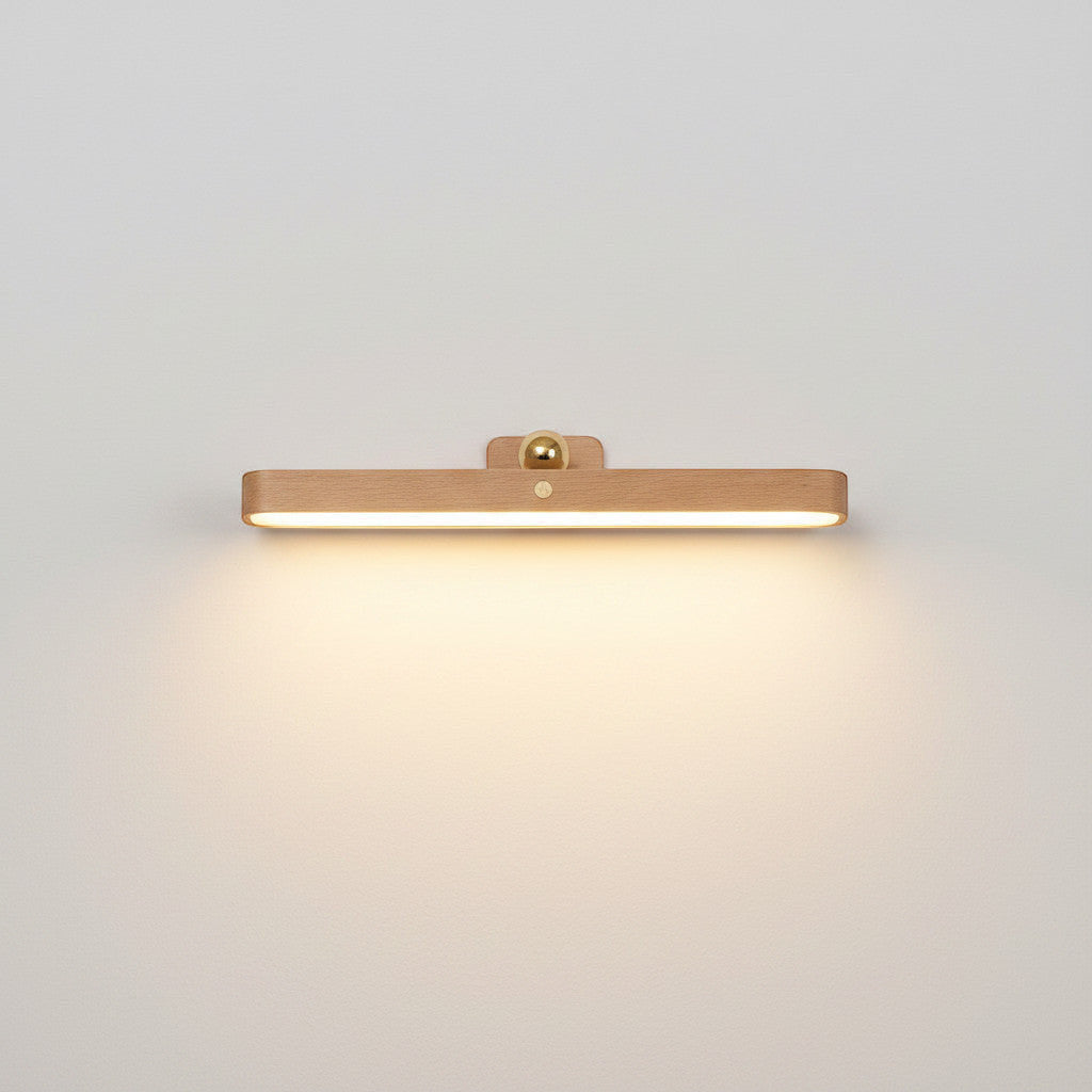 Lysverden wooden picture light with acrylic diffuser, brass detail, touch control, and magnetic mount. 4000K.