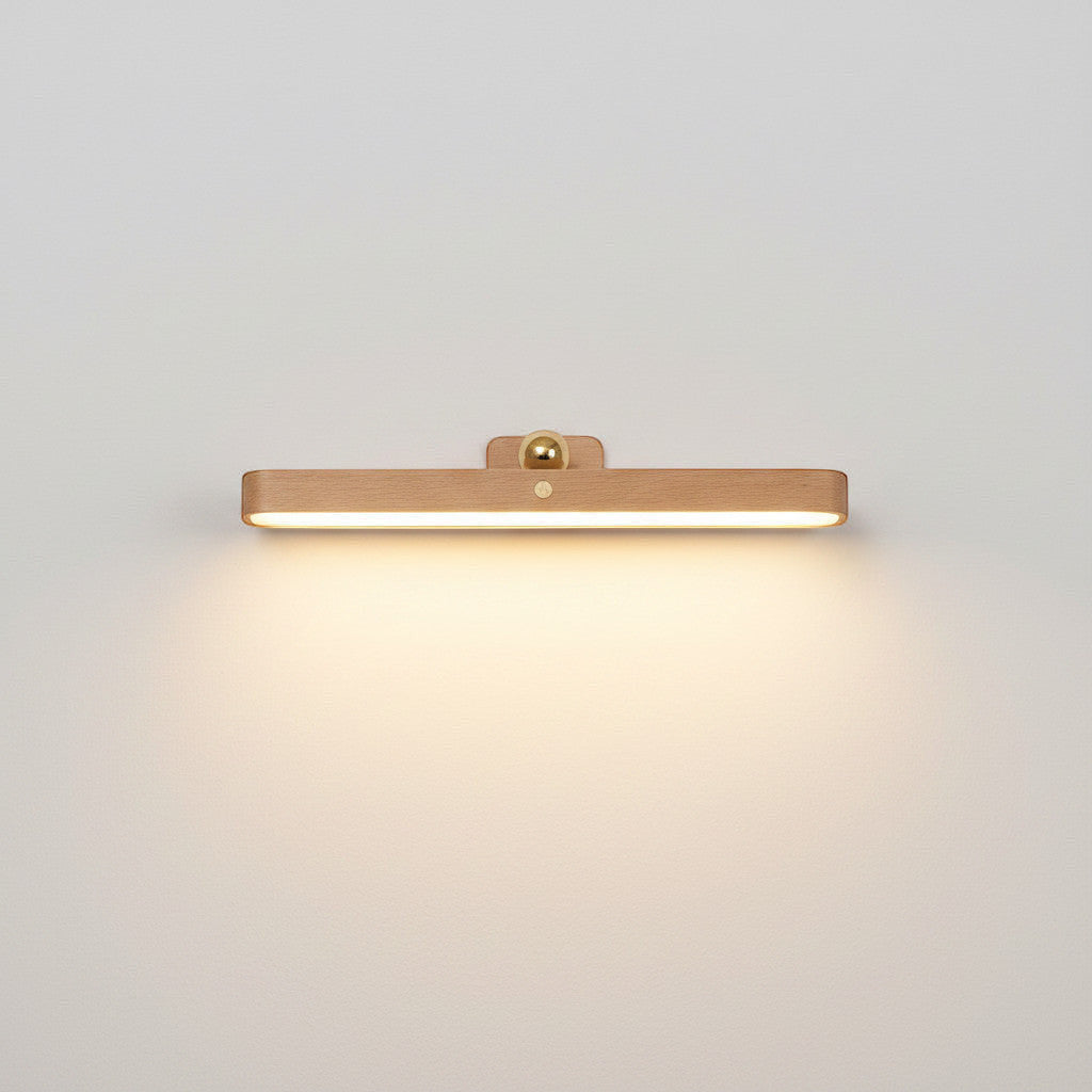 Lysverden wooden picture light with acrylic diffuser, brass detail, touch control, and magnetic mount. 4000K.