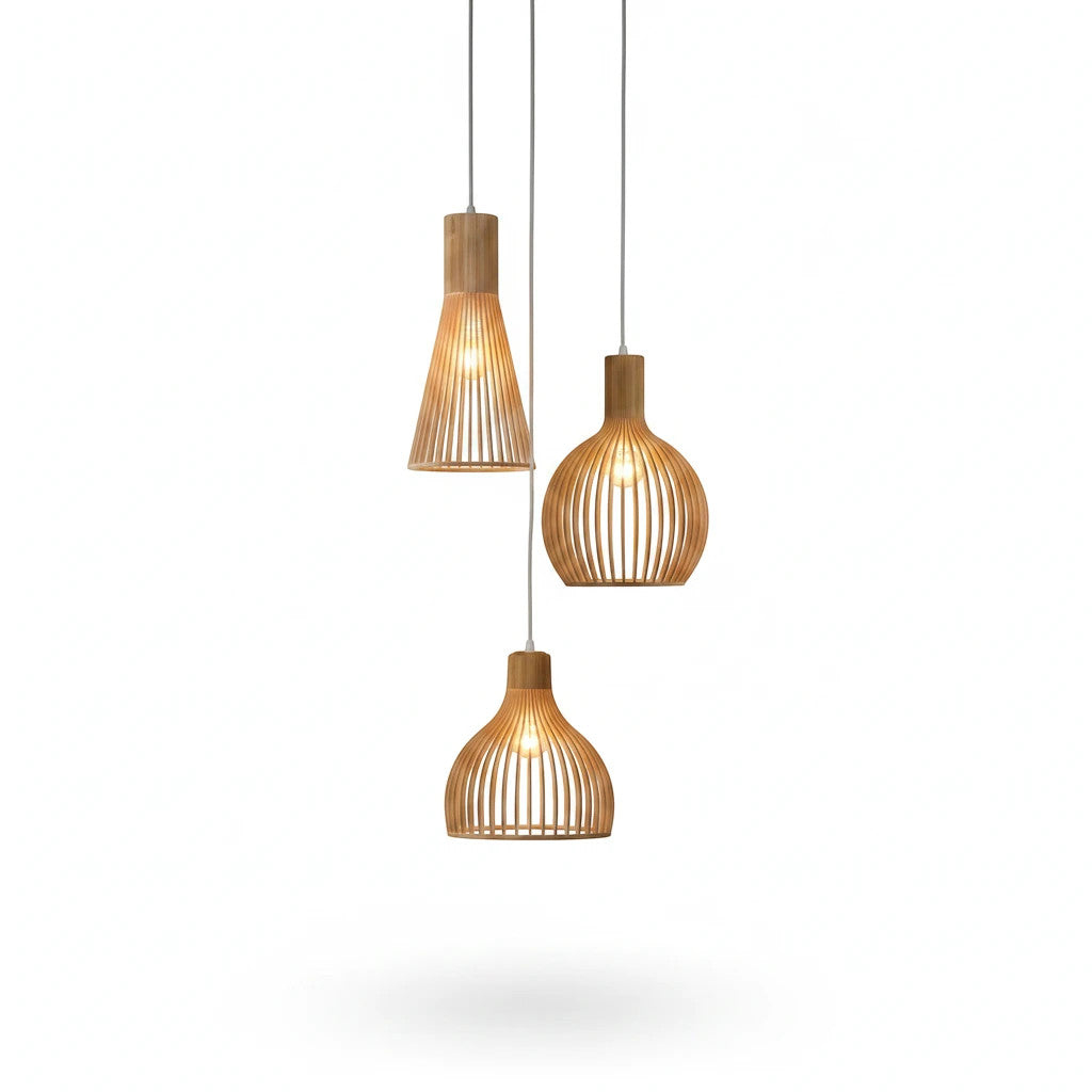 Lysverden set of three sculptural wooden slat pendant lights with warm glowing bulbs in a Japandi style design.