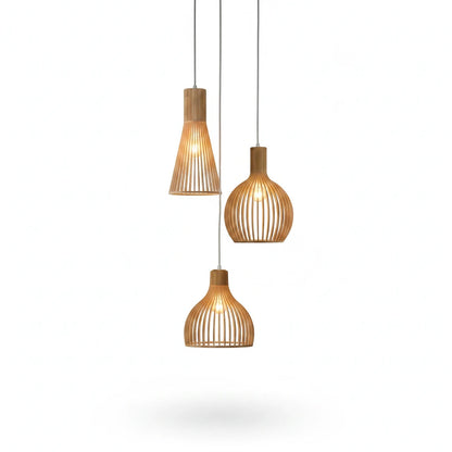 Lysverden set of three sculptural wooden slat pendant lights with warm glowing bulbs in a Japandi style design.
