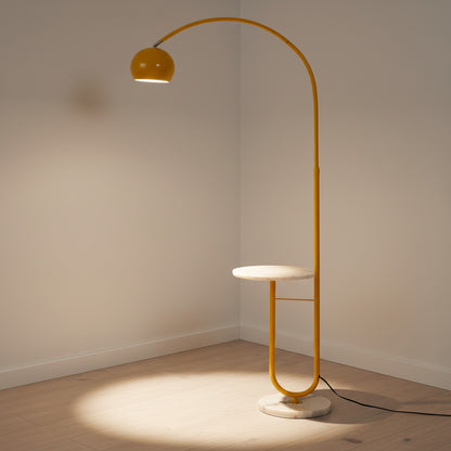 Lysverden yellow arched floor lamp with a white stone base and integrated side table in a minimalist room