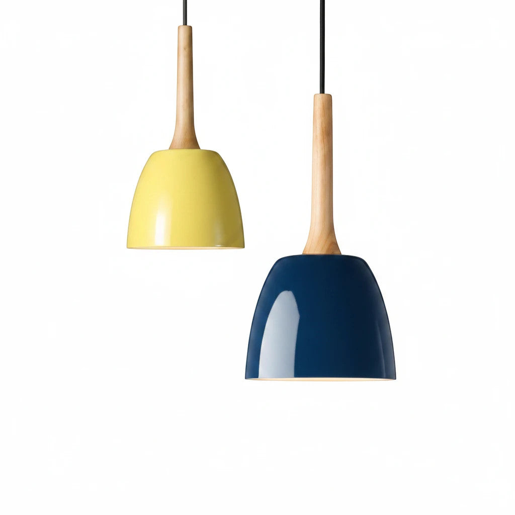 Lysverden pendant lamps with yellow and blue metal domes and light wood tops in a playful Nordic design.