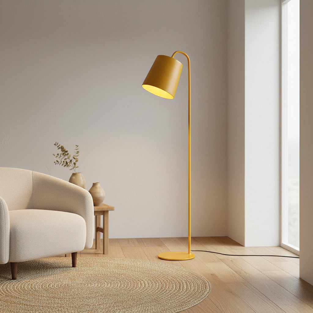 Lysverden yellow metal floor lamp with a cone-shaped shade and integrated LED standing in a modern living room.
