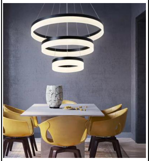 Sort LED-lysekrone med tre konsentriske lysende ringer over spisebord